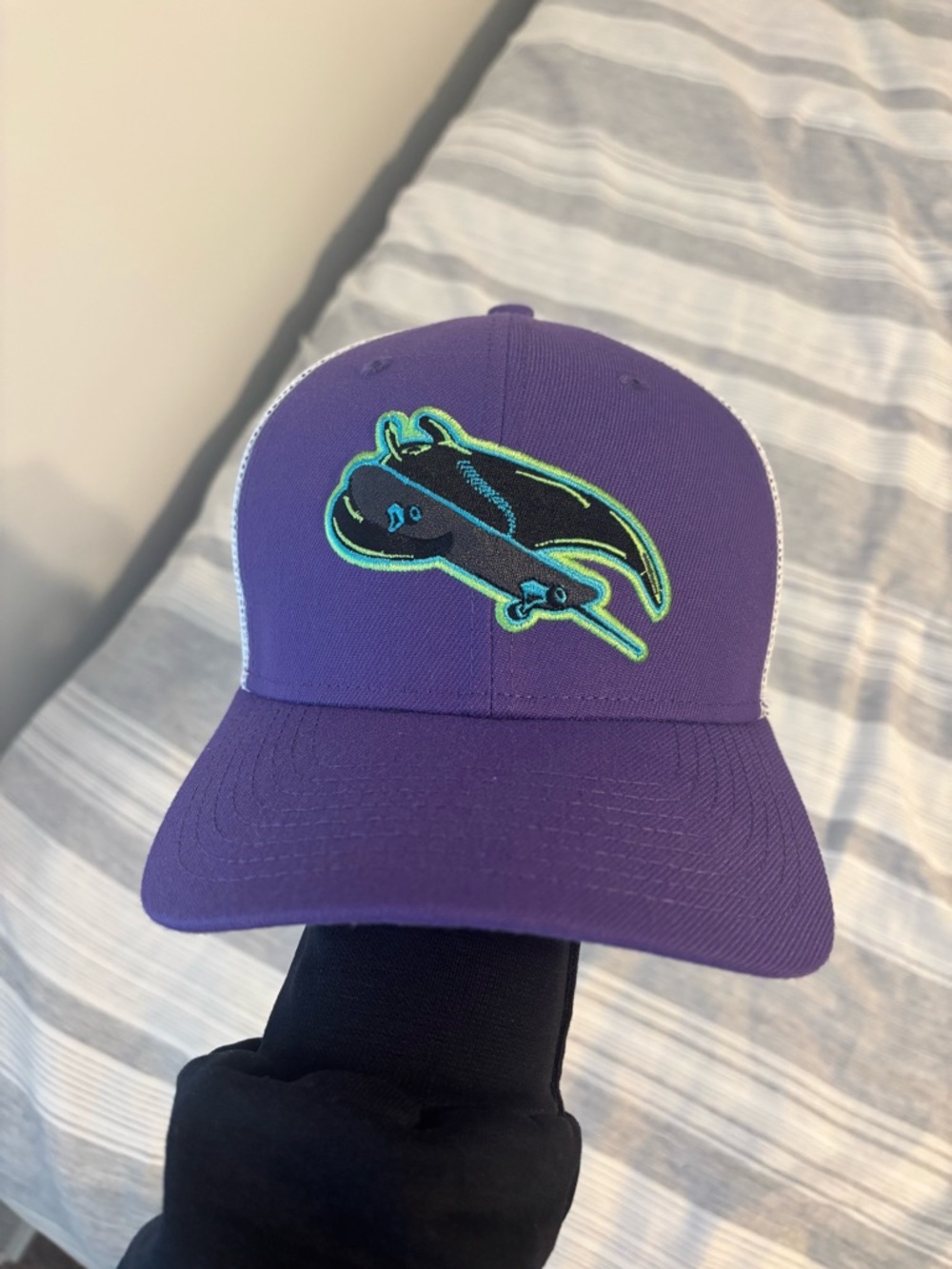 Purple Trucker Hat with Neon Fish Patch
